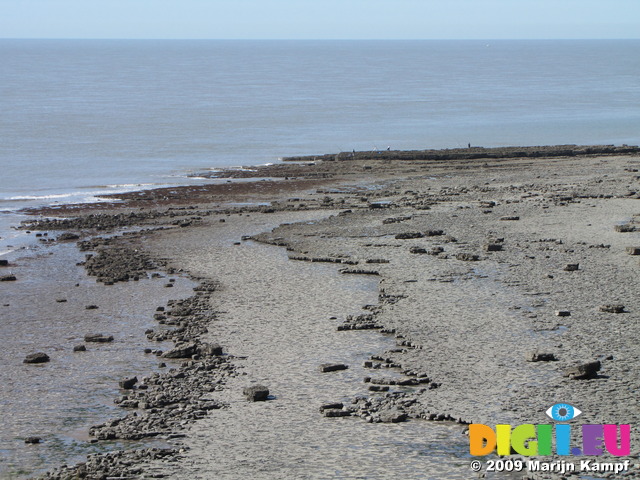 SX05186 Rocks on beach by Nas Point lighthouse